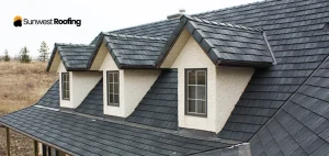 A house featuring a newly installed black shingle roof with three prominent dormers.