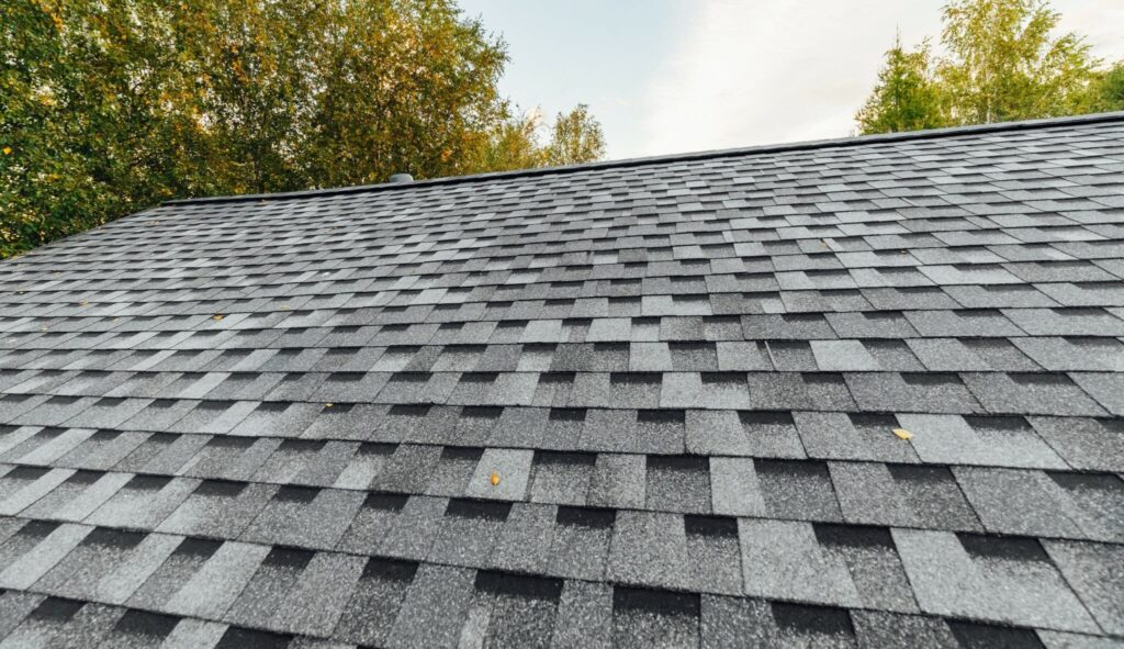 A clean, newly installed grey architectural asphalt shingle roof.